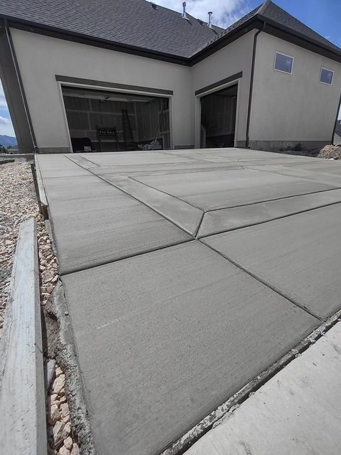 A new concrete garage slab poured and floated smooth